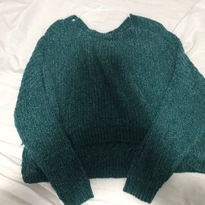 A green long sleeve cropped sweater